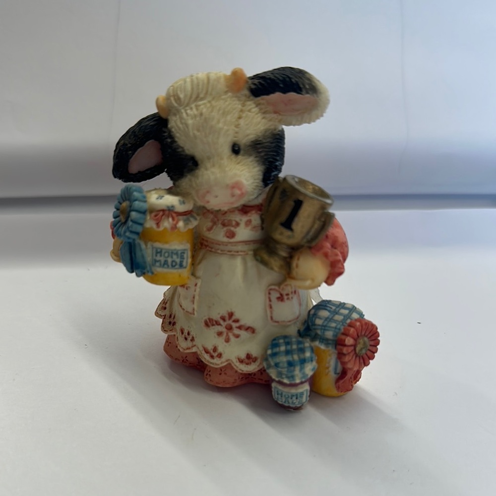Charming Cow Figurine with Colorful Details